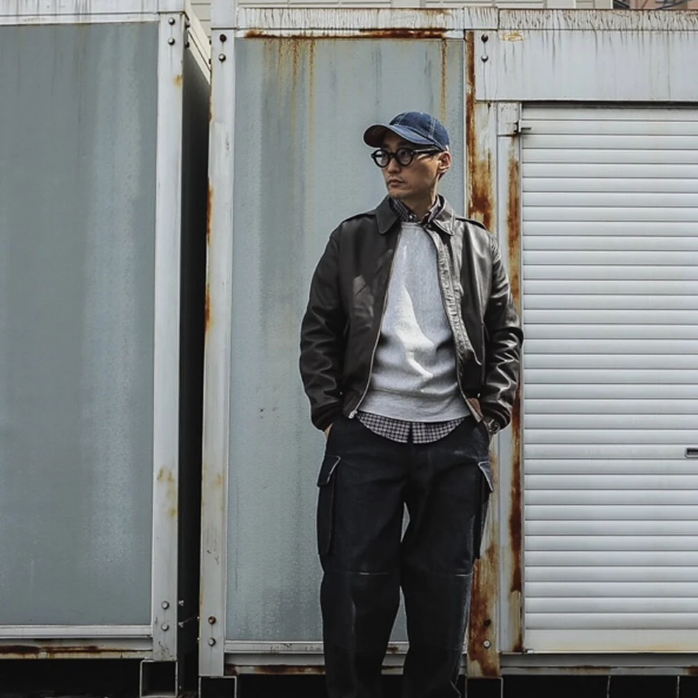 Baseball Cap + Leather Bomber Jacket + Dress Pants